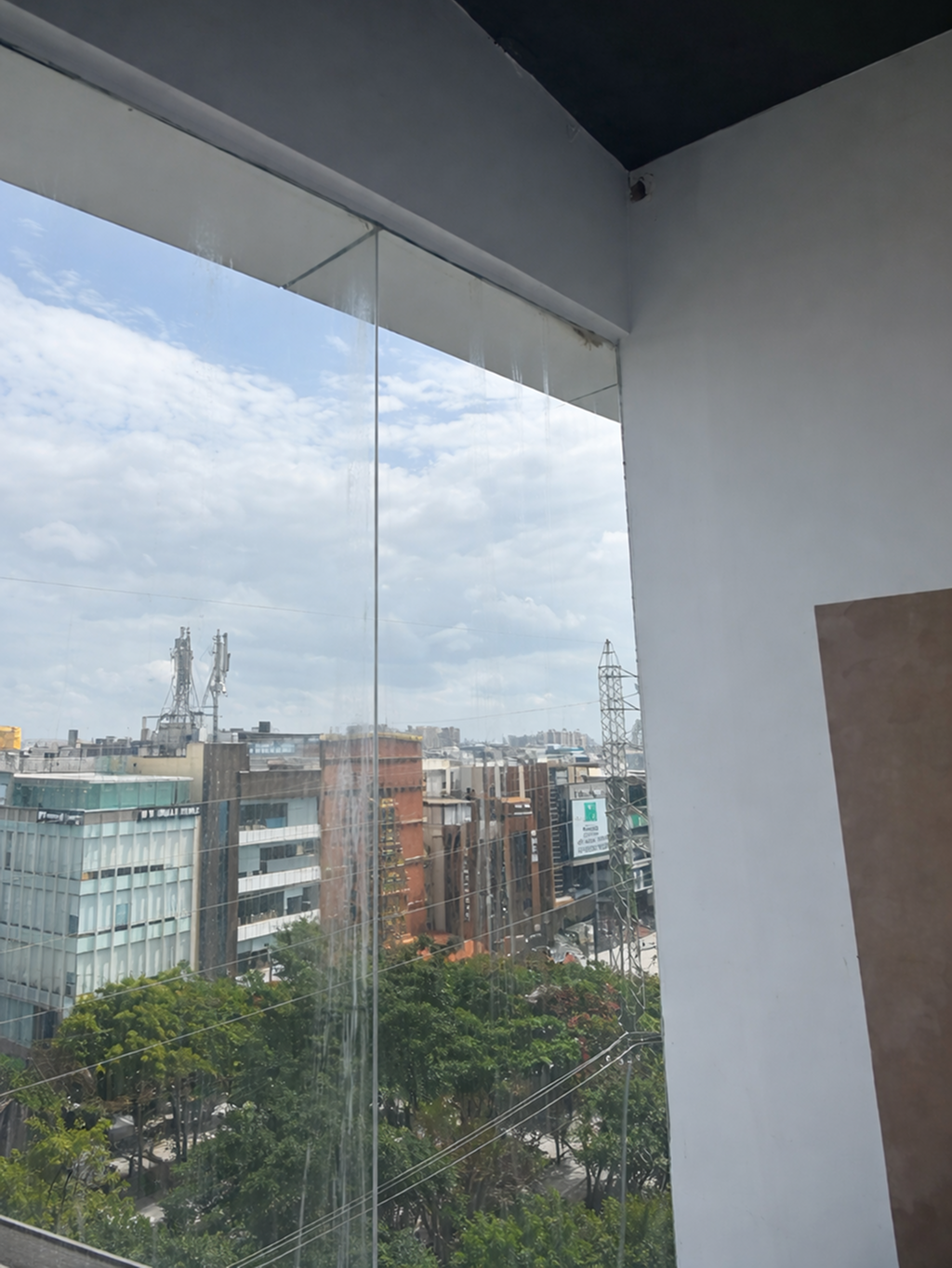 After — calcium deposit removal commercial glass facade Bangalore