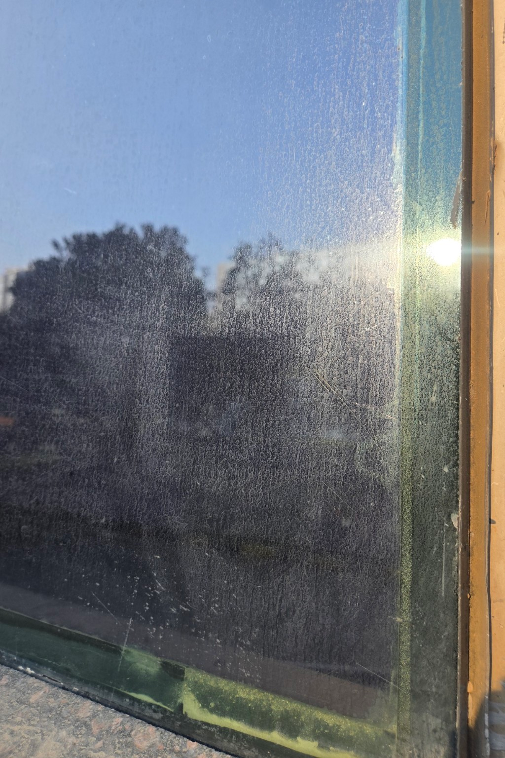 Before — mineral deposit glass facade IT Park Bellandur Bangalore